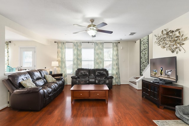 living room featuring dark hardwood / wood-style floors, a wealth of natural light, and ceiling fan