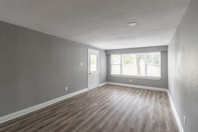 spare room featuring hardwood / wood-style flooring