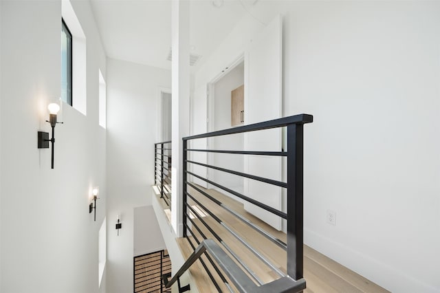 stairway with wood-type flooring