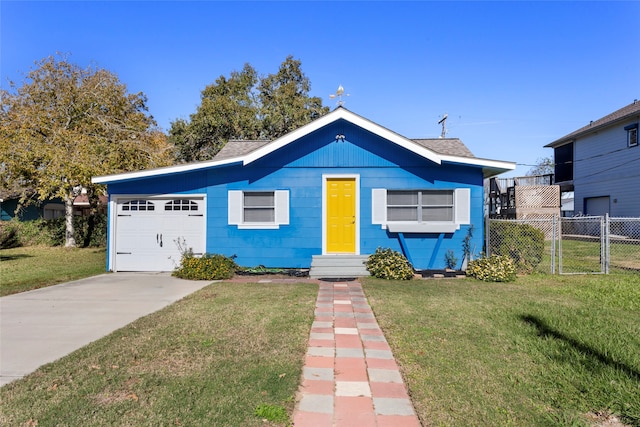 view of front facade with a garage and a front lawn