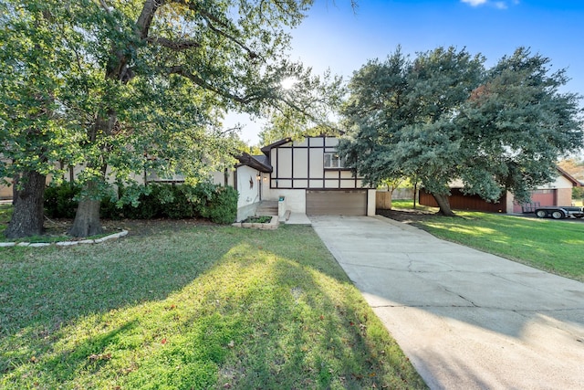 view of front of house featuring a garage and a front yard