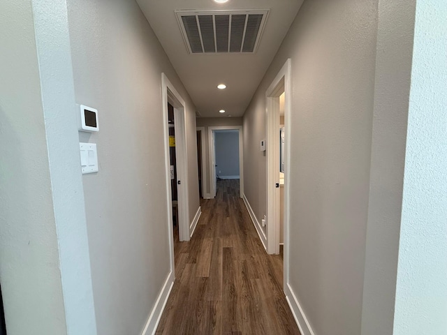 hallway featuring dark wood-type flooring