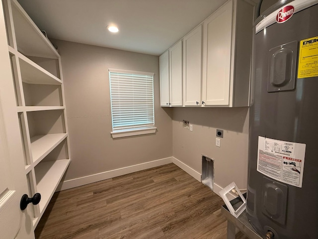 laundry room featuring cabinets, electric dryer hookup, dark hardwood / wood-style flooring, and electric water heater