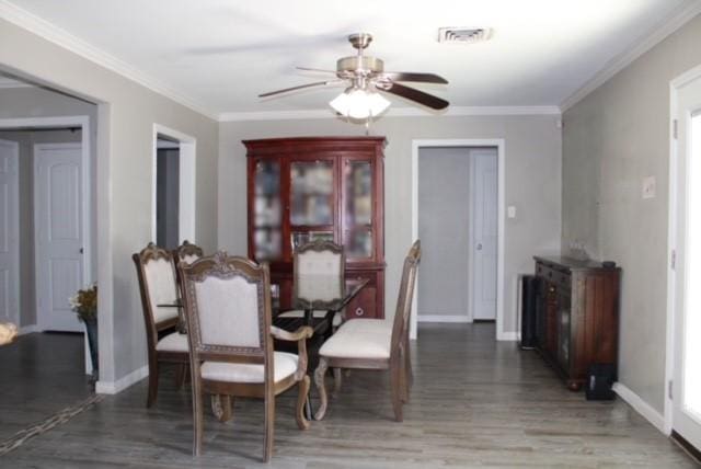 dining space featuring crown molding and ceiling fan