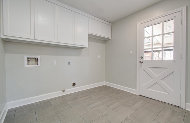 laundry area with electric dryer hookup, hookup for a washing machine, and cabinets