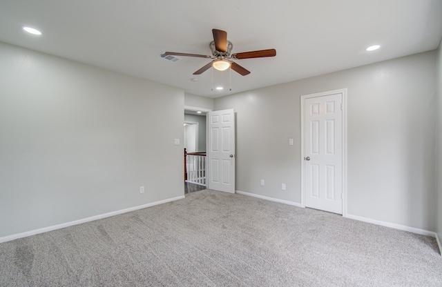 carpeted empty room with ceiling fan