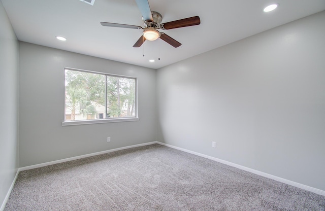 spare room with ceiling fan and carpet floors