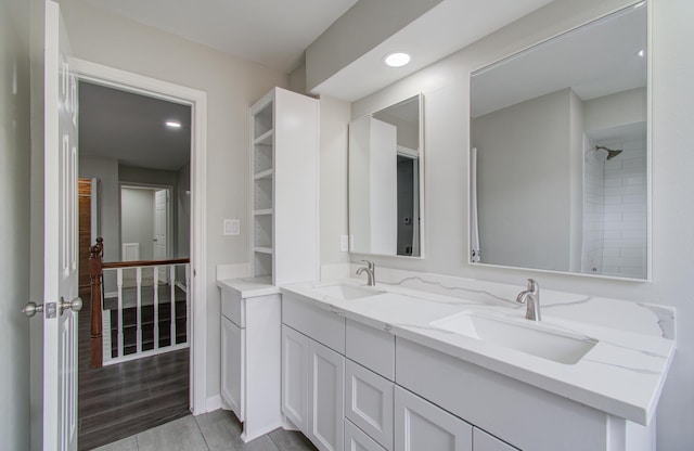 bathroom featuring hardwood / wood-style floors and vanity