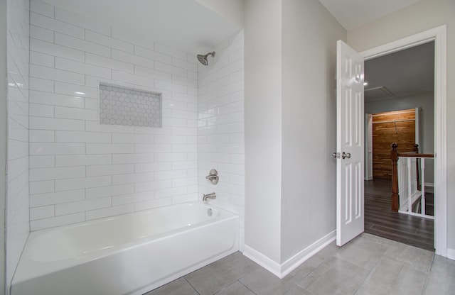 bathroom featuring hardwood / wood-style floors and tiled shower / bath