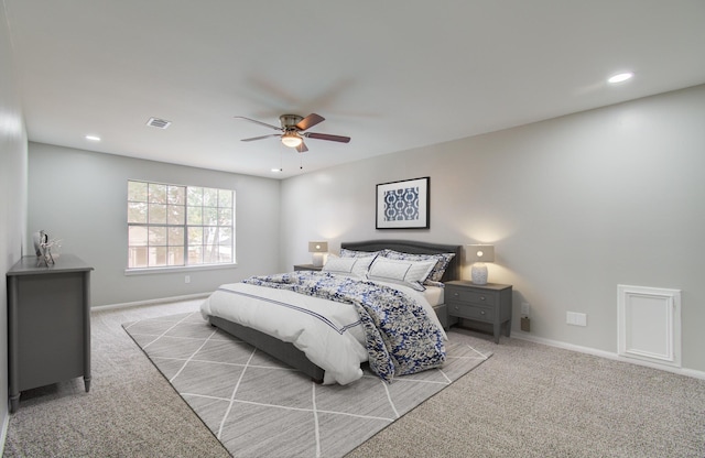 bedroom featuring ceiling fan and light carpet