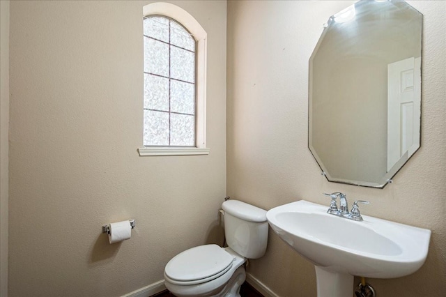 bathroom with sink and toilet