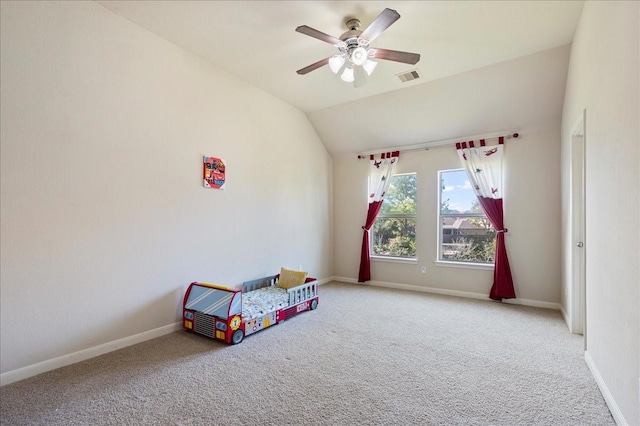 playroom featuring carpet, ceiling fan, and vaulted ceiling