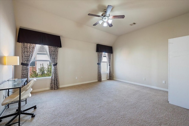 unfurnished office featuring ceiling fan, carpet, and lofted ceiling