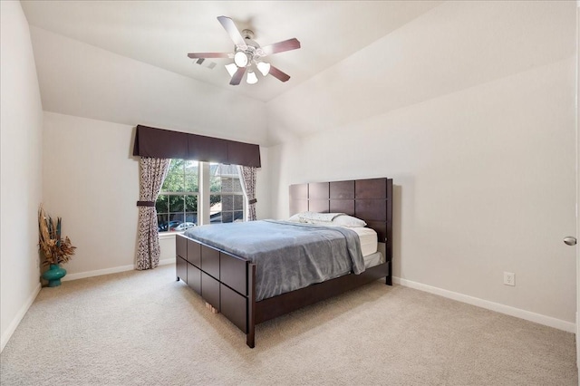 carpeted bedroom featuring vaulted ceiling and ceiling fan