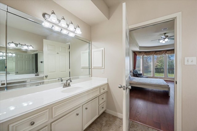 bathroom featuring vanity, hardwood / wood-style flooring, and ceiling fan