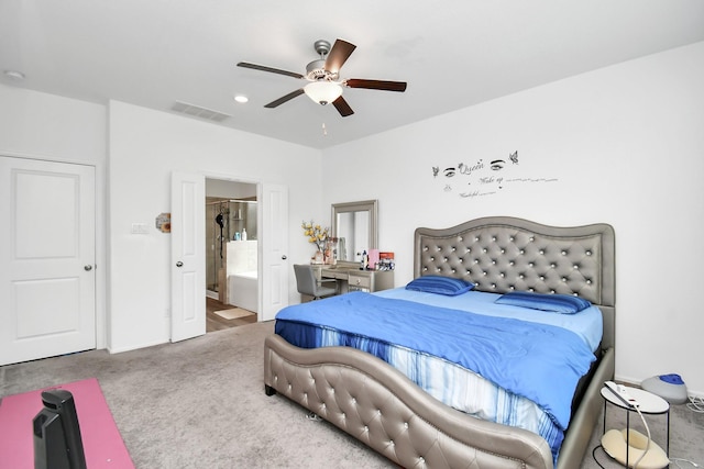 bedroom featuring carpet, ensuite bath, and ceiling fan