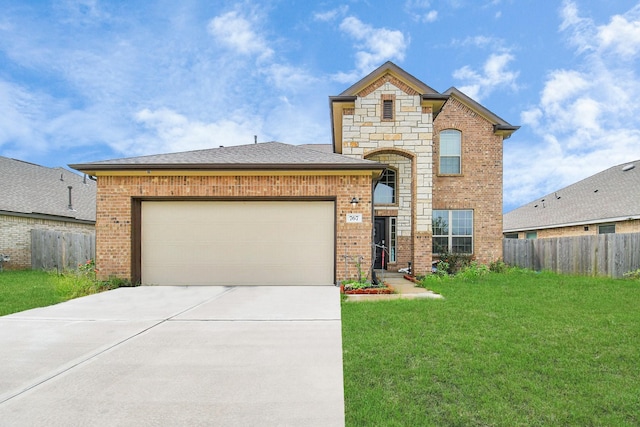 view of front of property with a front yard and a garage