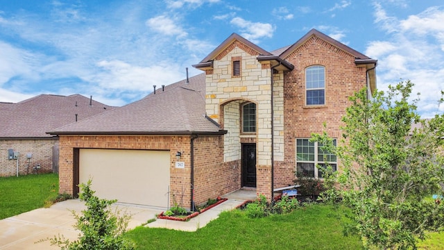 view of front property featuring a front yard and a garage