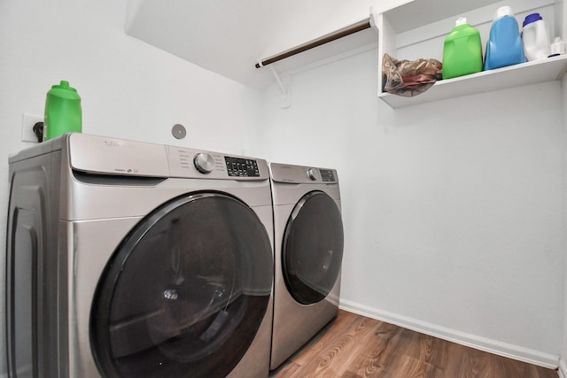 laundry area featuring hardwood / wood-style flooring and independent washer and dryer