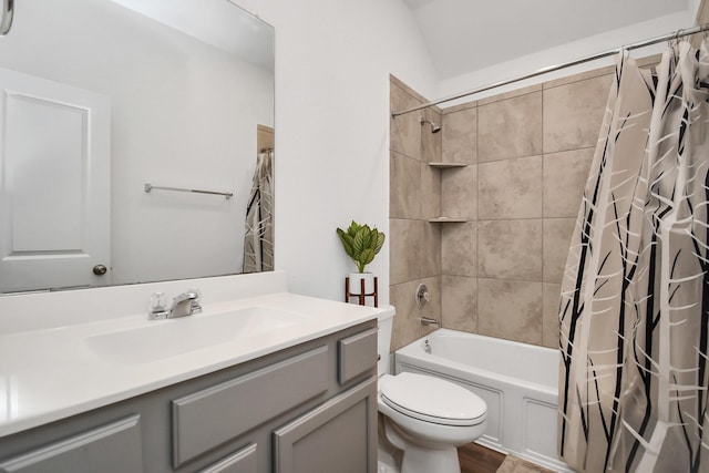 full bathroom with shower / bath combination with curtain, vanity, vaulted ceiling, wood-type flooring, and toilet