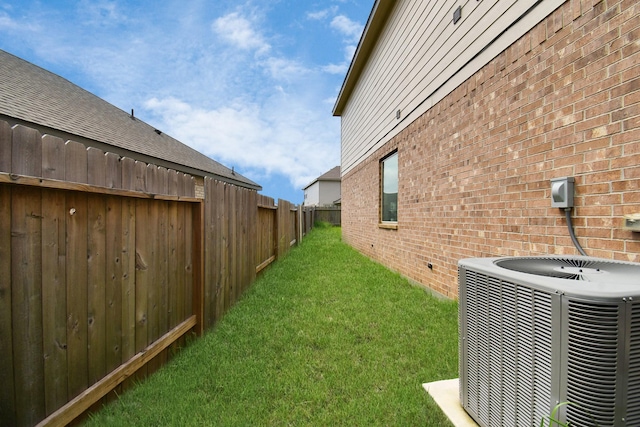 view of yard with central AC