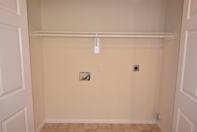 washroom featuring hookup for an electric dryer, light tile patterned floors, and hookup for a washing machine