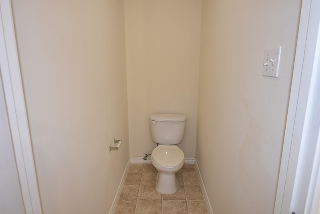 bathroom featuring tile patterned floors and toilet