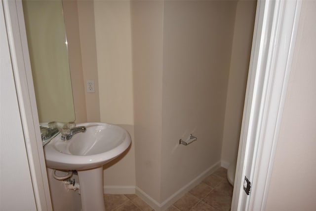 bathroom featuring tile patterned flooring and sink