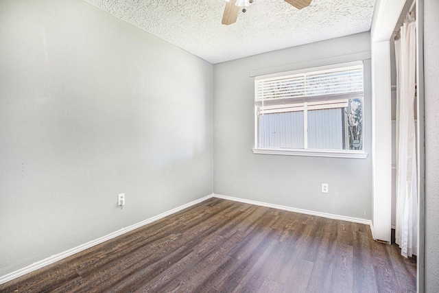 unfurnished room featuring a textured ceiling, dark hardwood / wood-style floors, and ceiling fan