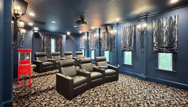 cinema room featuring carpet floors