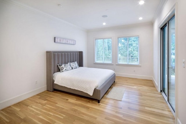 bedroom with crown molding and light hardwood / wood-style flooring