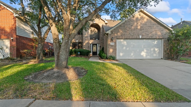 view of front property featuring a garage and a front yard