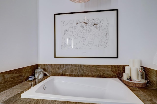 bathroom with a relaxing tiled tub