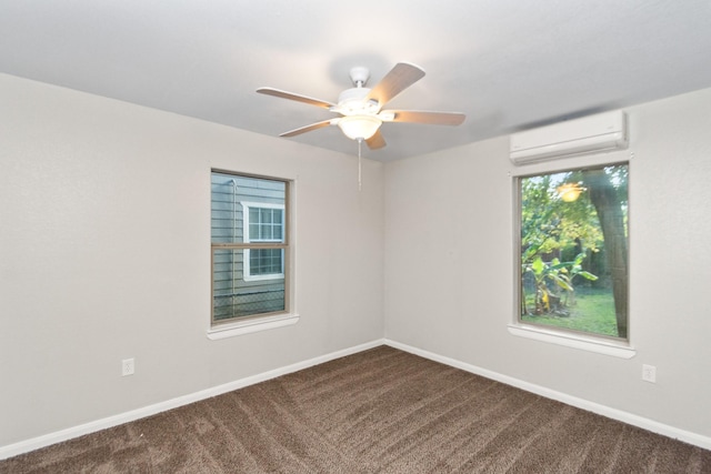 spare room with a wall mounted air conditioner, carpet flooring, and ceiling fan