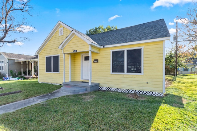 bungalow with a front yard