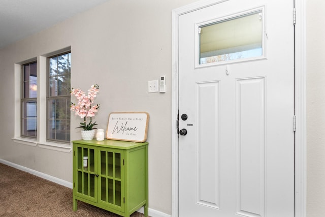 doorway with carpet floors