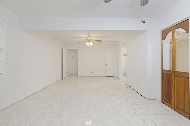 empty room featuring ceiling fan