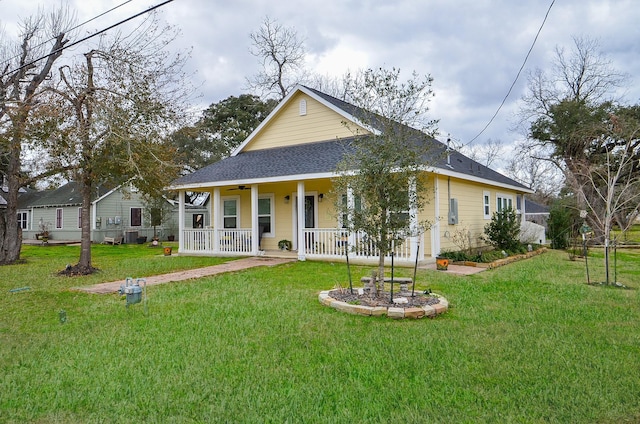 view of front of property featuring covered porch and a front yard