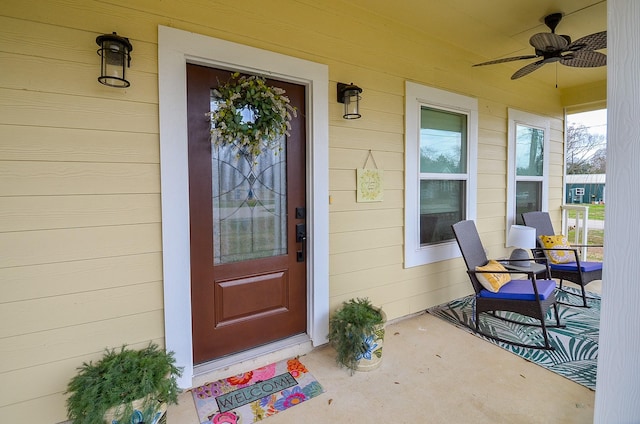 doorway to property featuring ceiling fan and covered porch