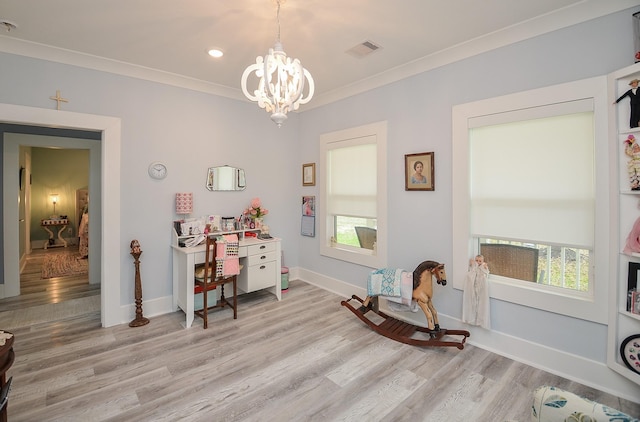 living area with a chandelier, light wood-type flooring, and plenty of natural light