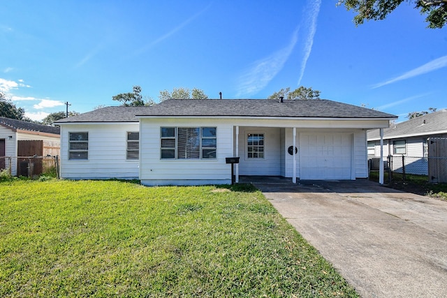 ranch-style house featuring a front yard and a garage