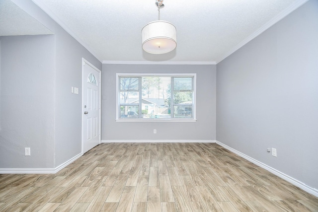 interior space with crown molding and light hardwood / wood-style floors