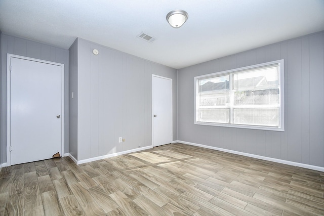 spare room featuring light hardwood / wood-style floors