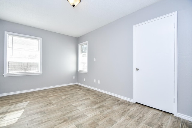 unfurnished room featuring light hardwood / wood-style flooring