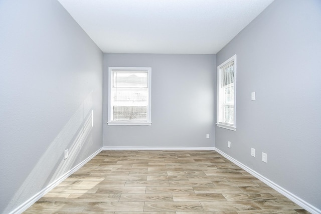 unfurnished room featuring light hardwood / wood-style flooring