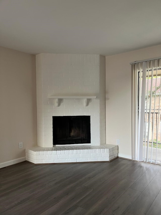 room details featuring hardwood / wood-style floors and a brick fireplace