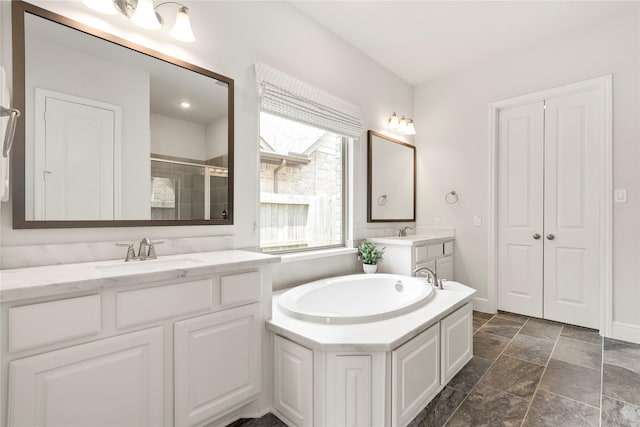 bathroom with plus walk in shower and vanity