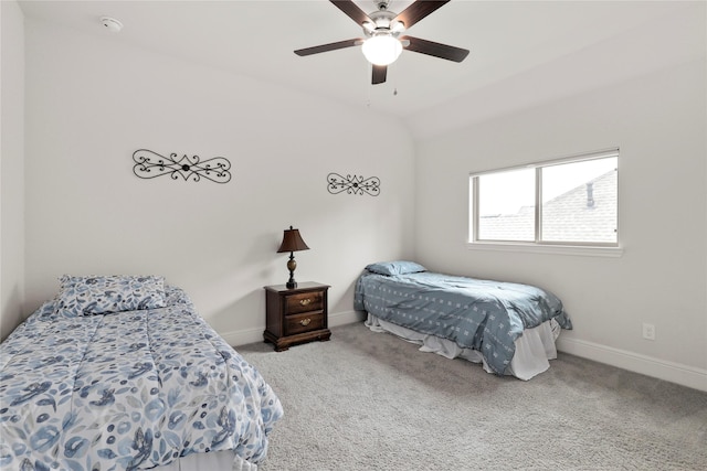 bedroom with ceiling fan, carpet, and vaulted ceiling