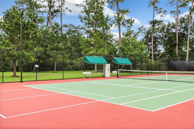 view of tennis court with a lawn and basketball court