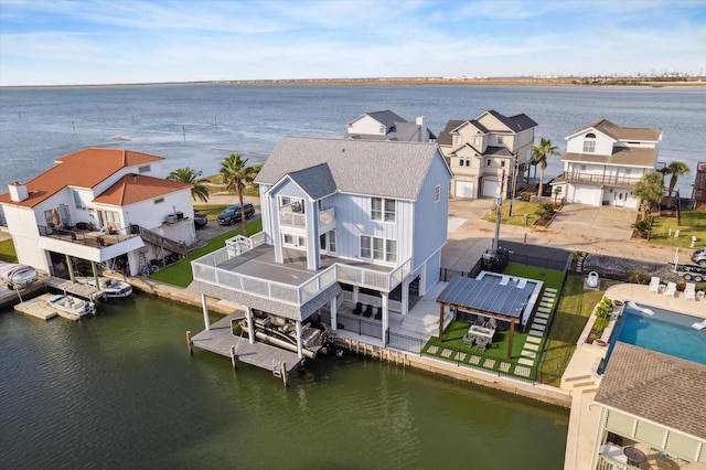 birds eye view of property featuring a water view